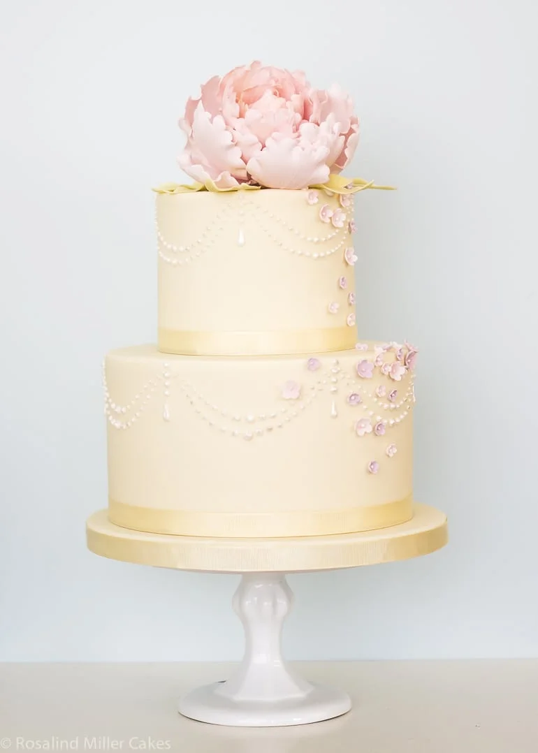 Peonies, Pearls and Drapes Wedding Cake in Pale Yellow and Pink