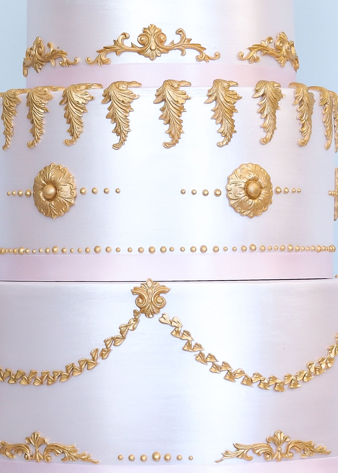 Pink and gold baroque shimmer wedding cake